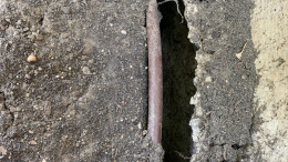 dry and cracked soil near foundation